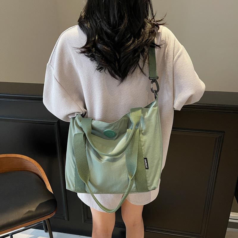 Simple literary cloth bag, women's work portable shoulder bag, large-capacity casual messenger tote bag