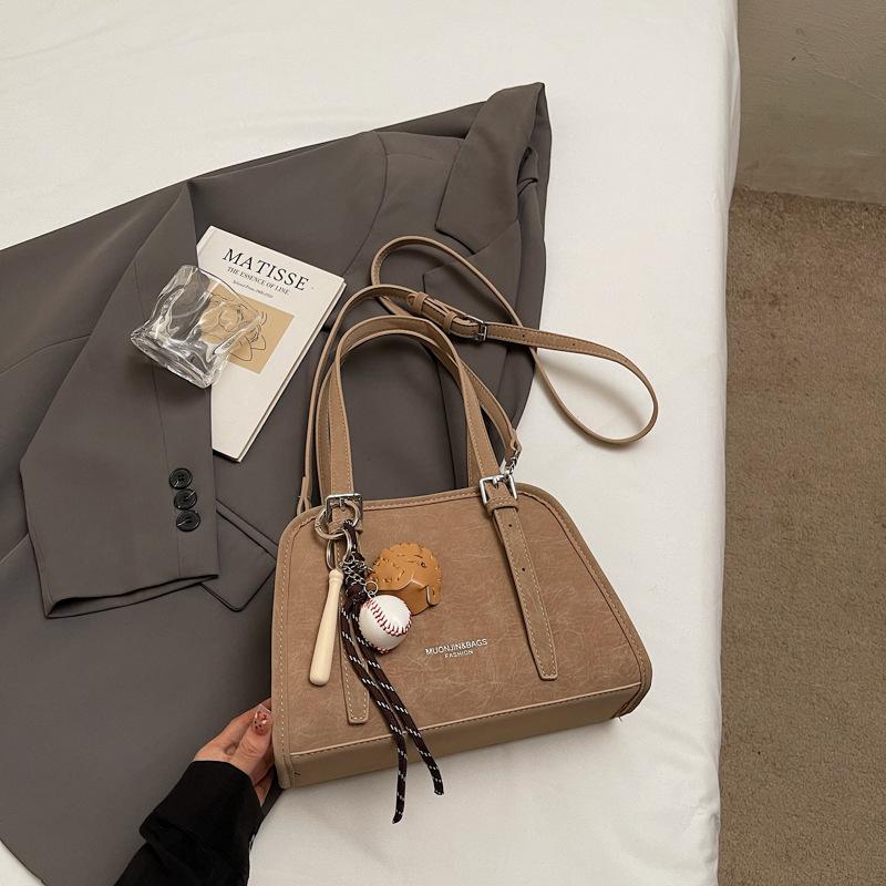 Korean version of high-value niche shoulder bag 2025 autumn new solid color fashion trend glossy underarm handbag women