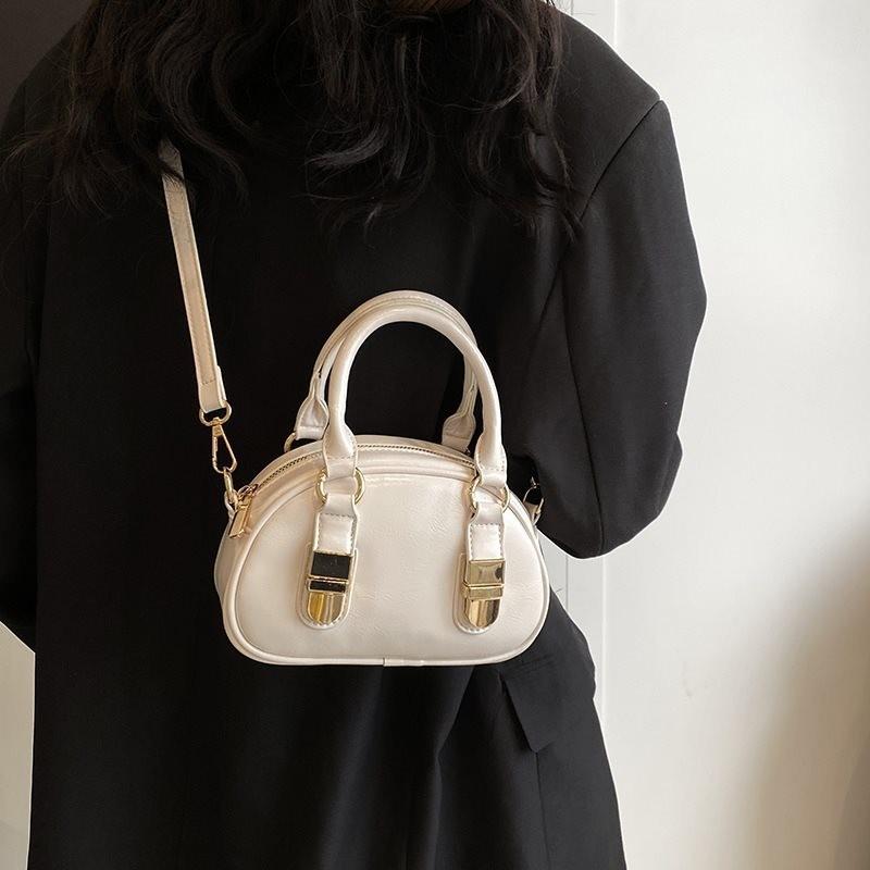 Elegant Urban Minimalist Shell Handbag For Women With Spacious Interior And Zipper Closure