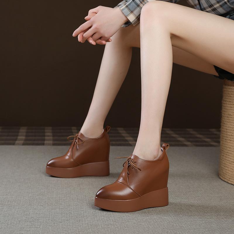 Wedge heel thick-soled leather single shoes women's 2025 new 12cm inner height increase pointed waterproof front strap-on deep mouth single shoes
