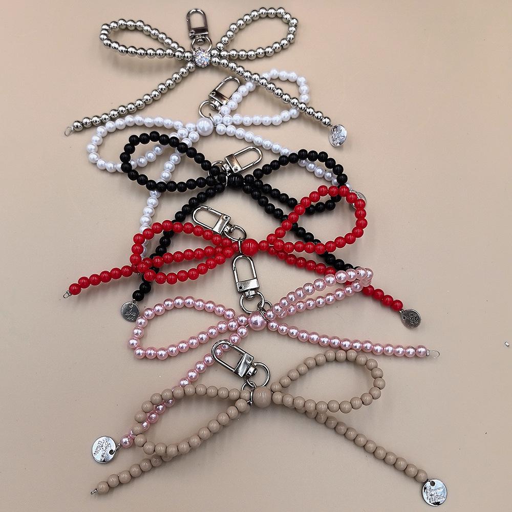 Portachiavi con Ciondolo a Forma di Fiocco d'Amore Placcato Argento per Telefoni - Raffinato Piccolo Accessorio Regalo