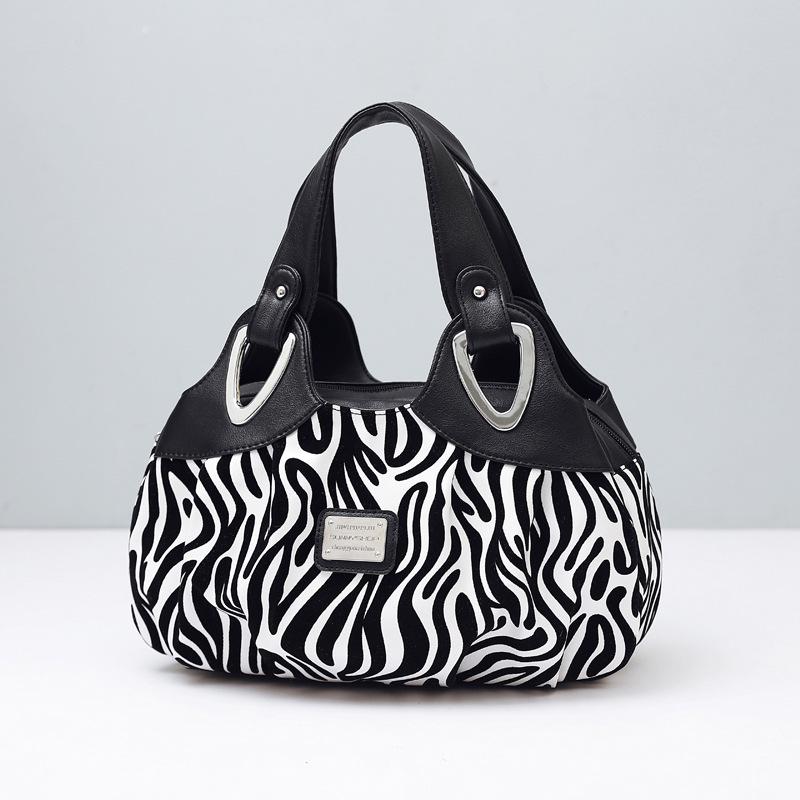 

Літня жіноча сумка великої місткості з м якої шкіри для модних мам