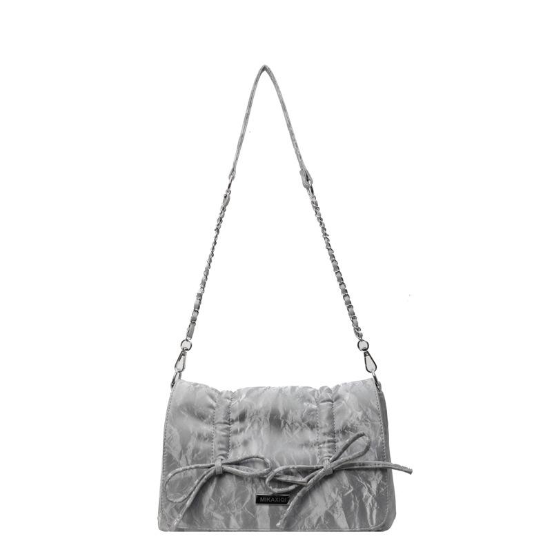 

This year, the popular bow bag women s 2025 new large-capacity simple messenger bag, high-end versatile shoulder bag серебряный