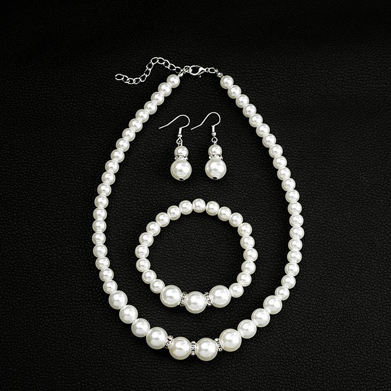 Elegante Set di Gioielli in Perle e Diamanti con Collana, Orecchini e Bracciale