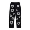 EastRogue High Street Hip Hop Streetwear Loose Fit Men's and Women's Denim Jeans with Washed Effect and Full Print of Hibiscus Flowers.