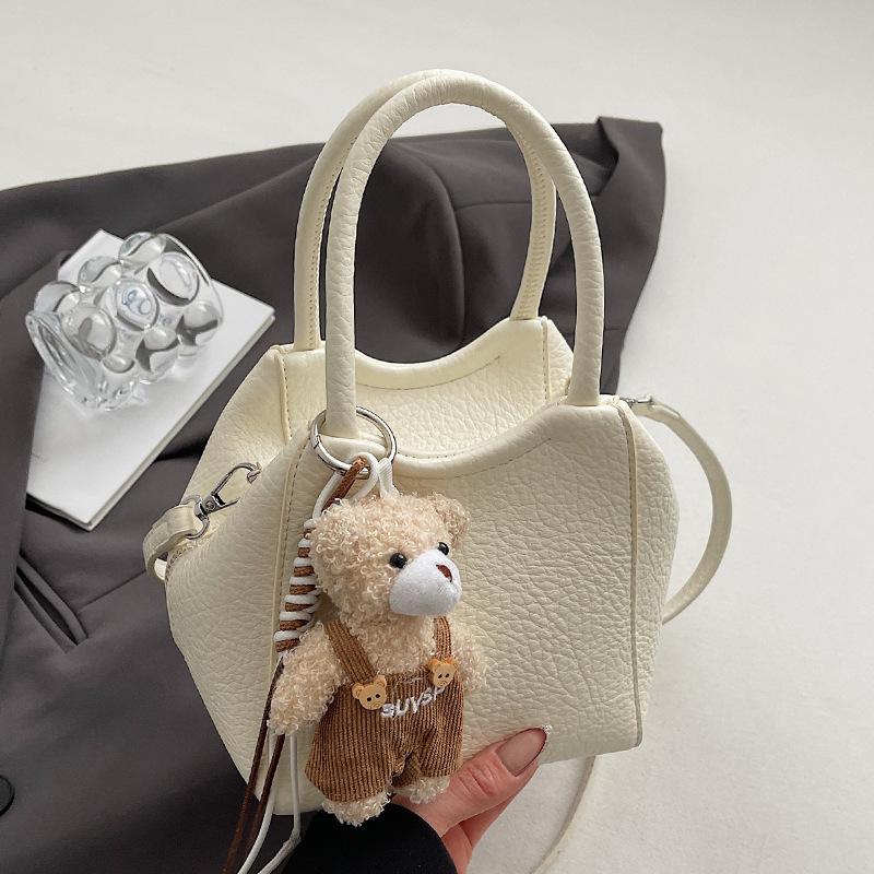 Wholesale fashion high sense simple style solid color lychee pattern bucket bag casual versatile commuter messenger women's bag