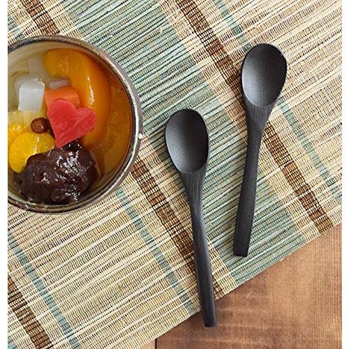 Stylish and smooth to the touch, this oval (black) bamboo spoon is a must-have.