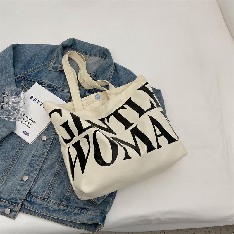 Large capacity letter canvas bag women's summer new Internet celebrity fashion single shoulder tote bag out hand-held shopping bag