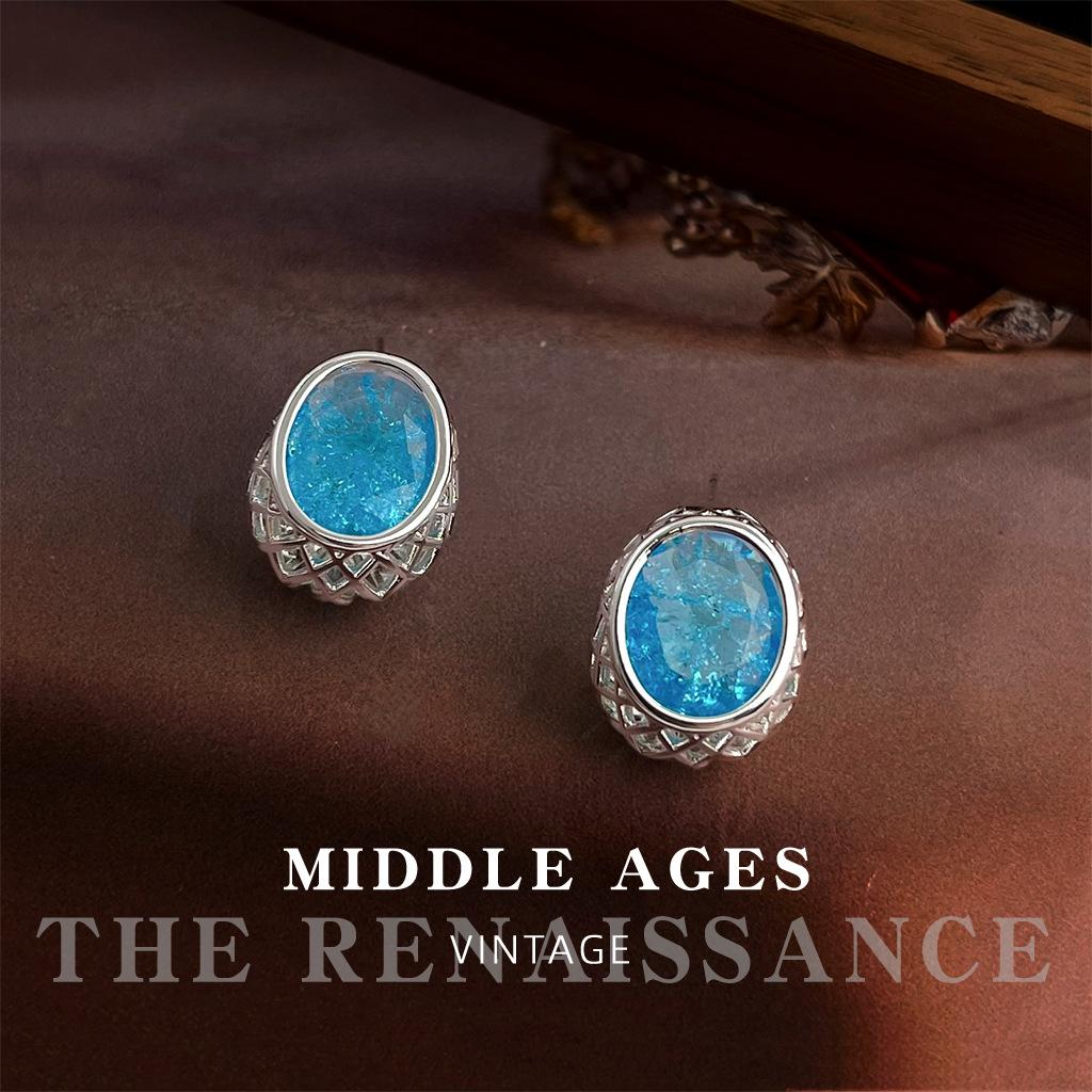 

Oval sea blue ice flower zircon earrings niche geometric hollow earrings