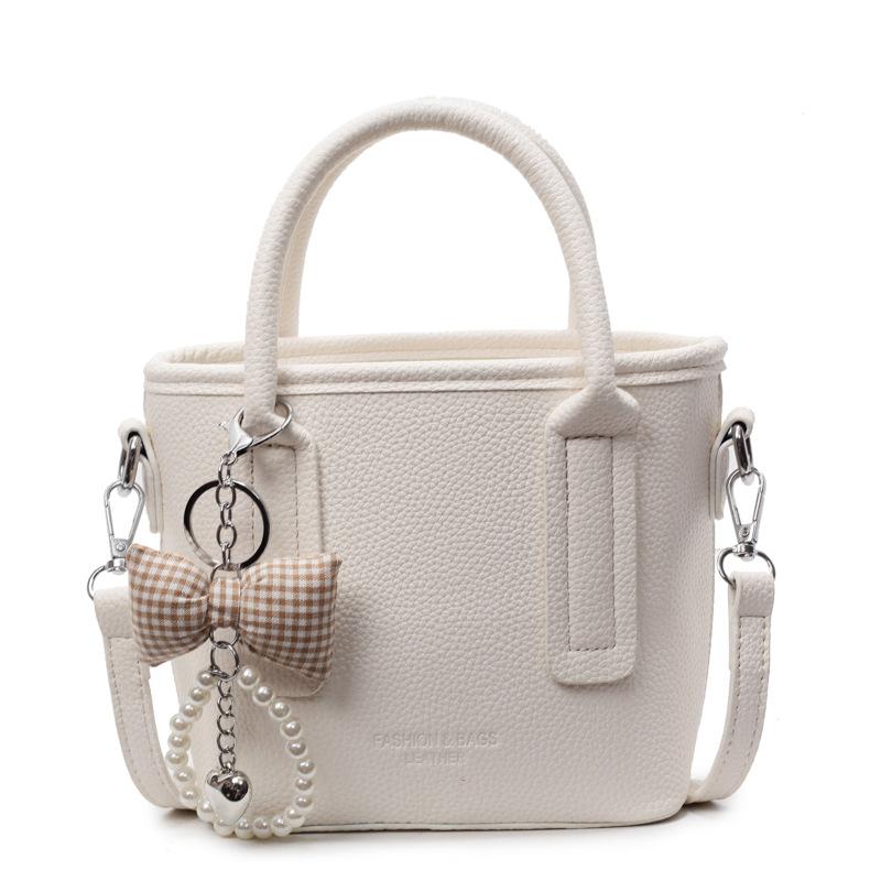 Spring and summer popular solid color simple high quality lychee pattern portable bucket bag women's fashion versatile commuter messenger bag
