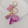 Purple Iridescent Resin Letter Keychain with Butterfly Tassel