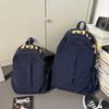 Solid color simple outdoor style backpack women's design sense niche light schoolbag high-value large-capacity backpack women