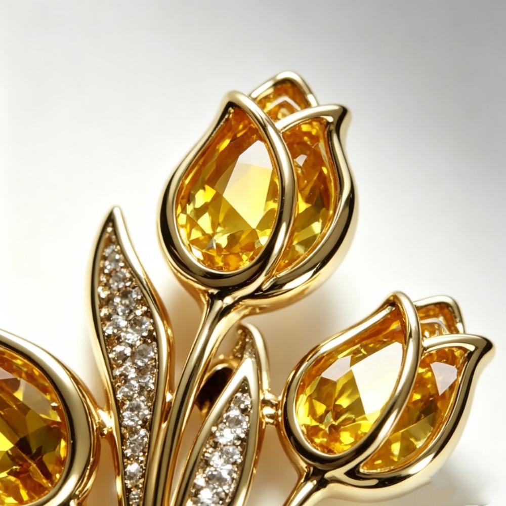 

Yellow crystal zircon three headed tulip. Paired with a natural freshwater pearl brooch. золотий