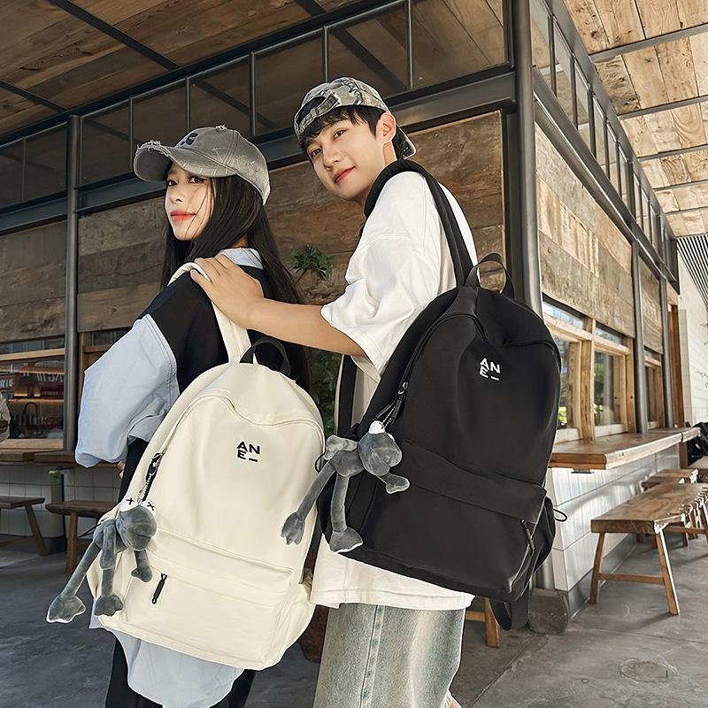 Korean version couple simple large-capacity backpack leisure commuter college student schoolbag niche light travel backpack women