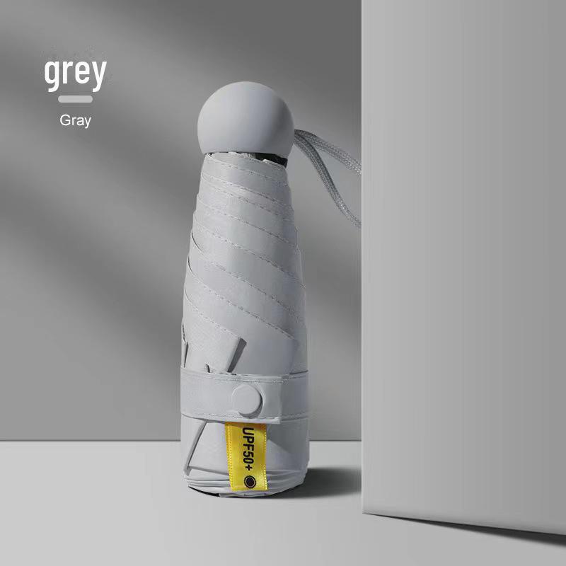 50 % rabatt på svart kapselparaply i lommeformat - Seks-skjerms sammenleggbar for sol og regn