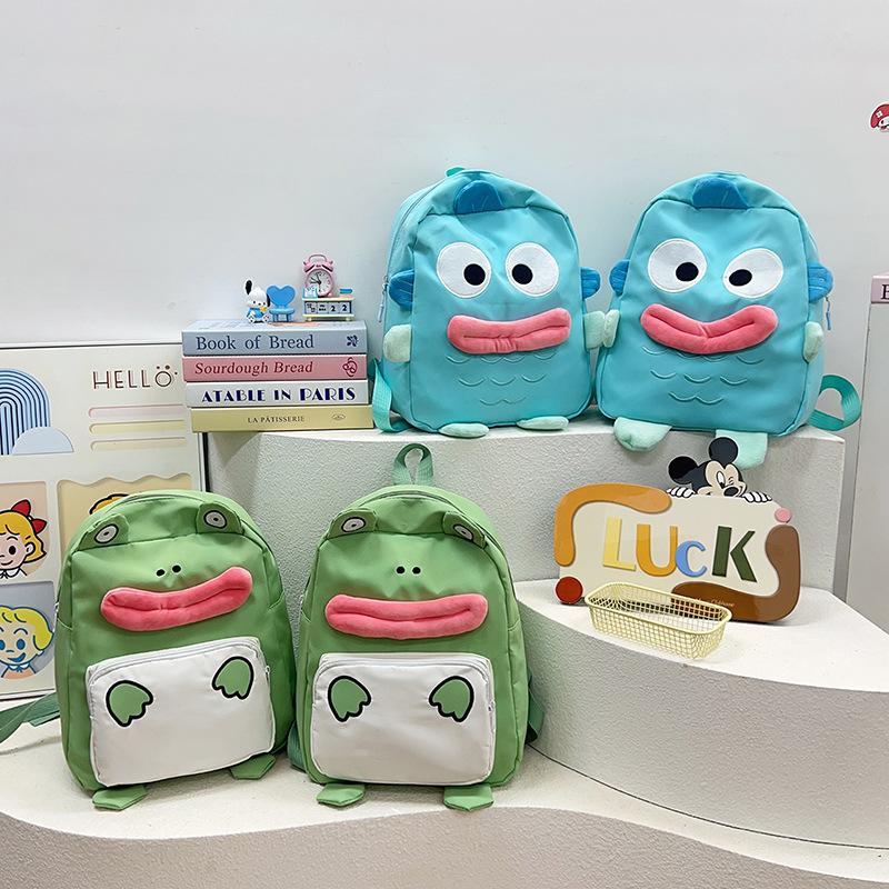 The new Japanese cute little frog backpack is the same for men and women, and the autumn versatile student large-capacity backpack bag.