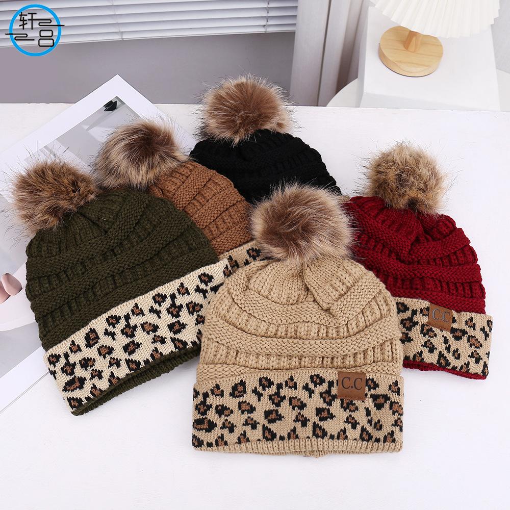 European and American fashion leopard print hairball decoration niche versatile knitted hat autumn and winter travel windproof warm wool hat