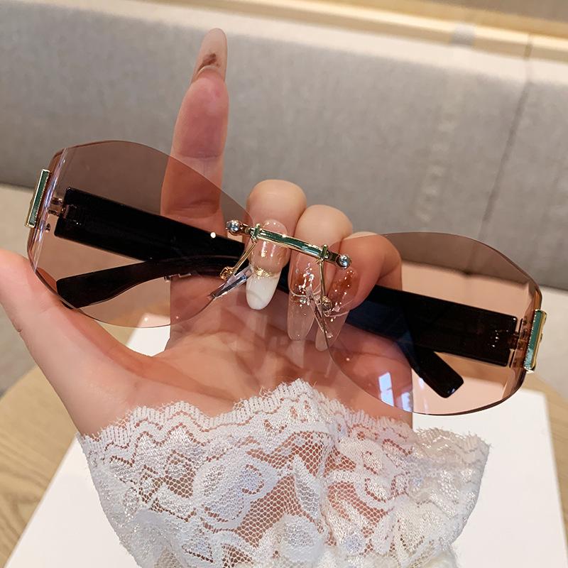 Women's Retro Frameless Oval Curved Lens Sunglasses Metal Sunglasses