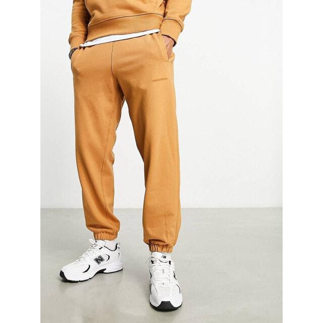 

Светло-коричневые спортивные штаны New Balance Athletics State