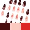 Red Almond-Shaped Press-On Nails with Bow and Star Design