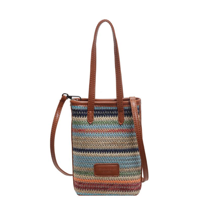 Niche lightweight versatile rainbow straw mobile phone bag spring and summer explosion leisure vacation style commuter messenger bag woman