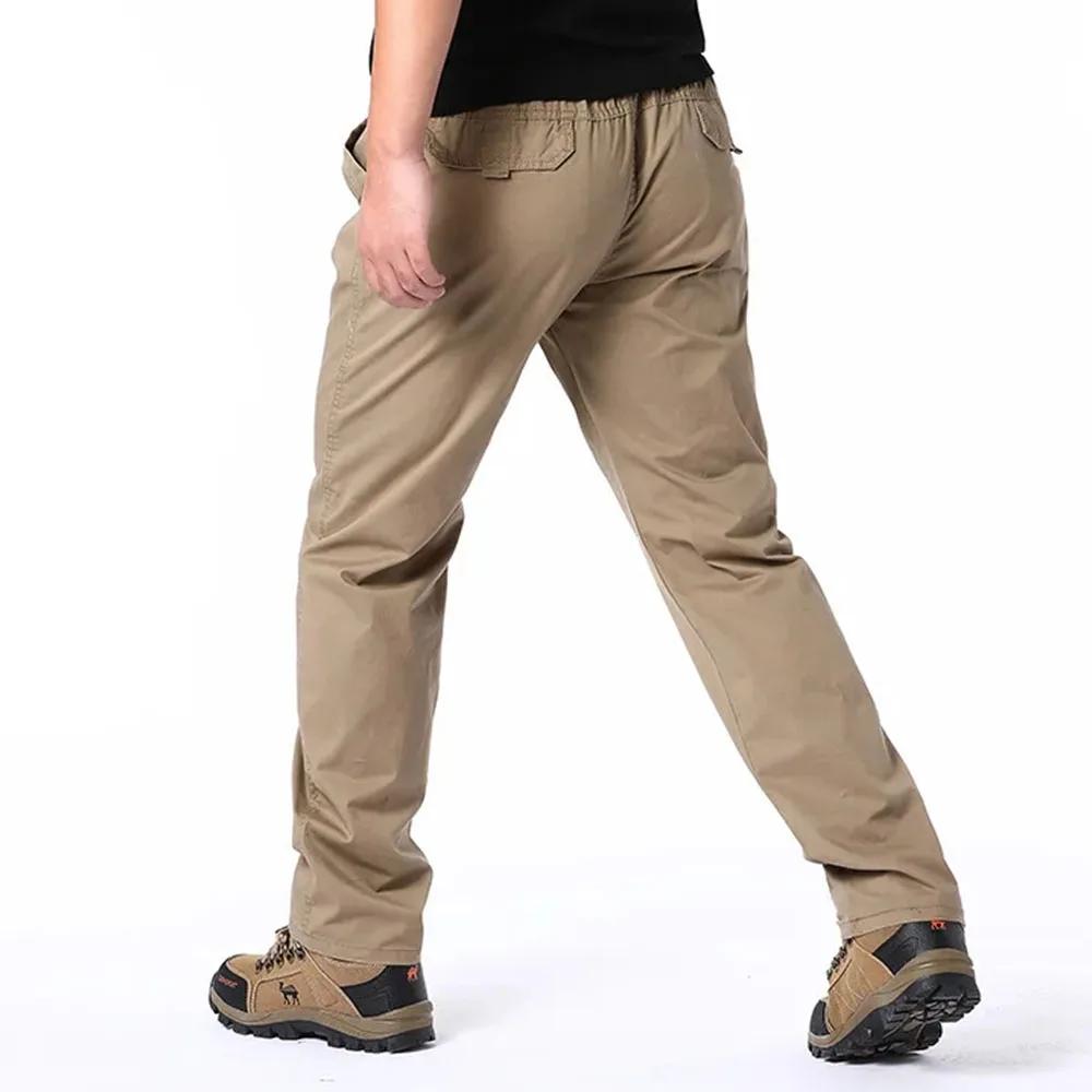 Wiosenne jesienne modne spodnie casualowe dla mężczyzn bawełniane spodnie cargo w jednolitym kolorze z elastyczną talią proste nogawki streetwear męskie spodnie joggers