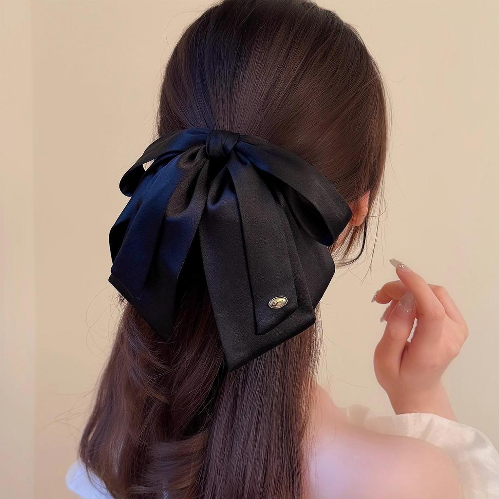Luxuriöse Satin-Schwarze Schleife Pferdeschwanz Krallenklemme mit Goldetikett für Elegante Hochsteckfrisur