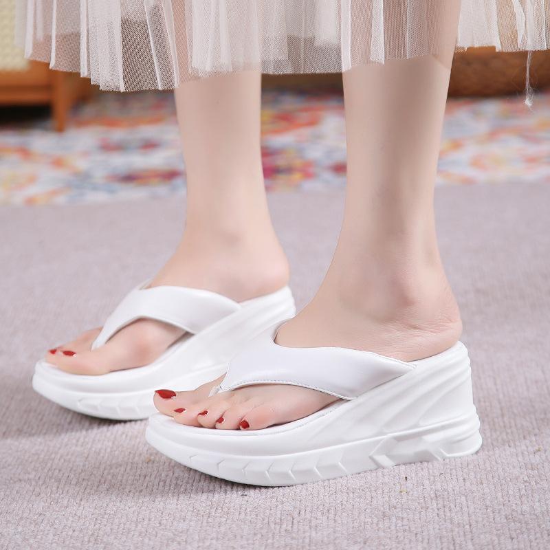 

Fairy wind with skirt flip-flops female 2024 summer new slope heel thick bottom beach mop fashion Roman mop 39