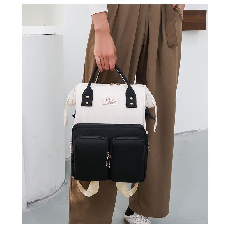 Mama's Multifunctional Backpack: Stylish Diaper Bag with Insulated Compartments & Changing Pad