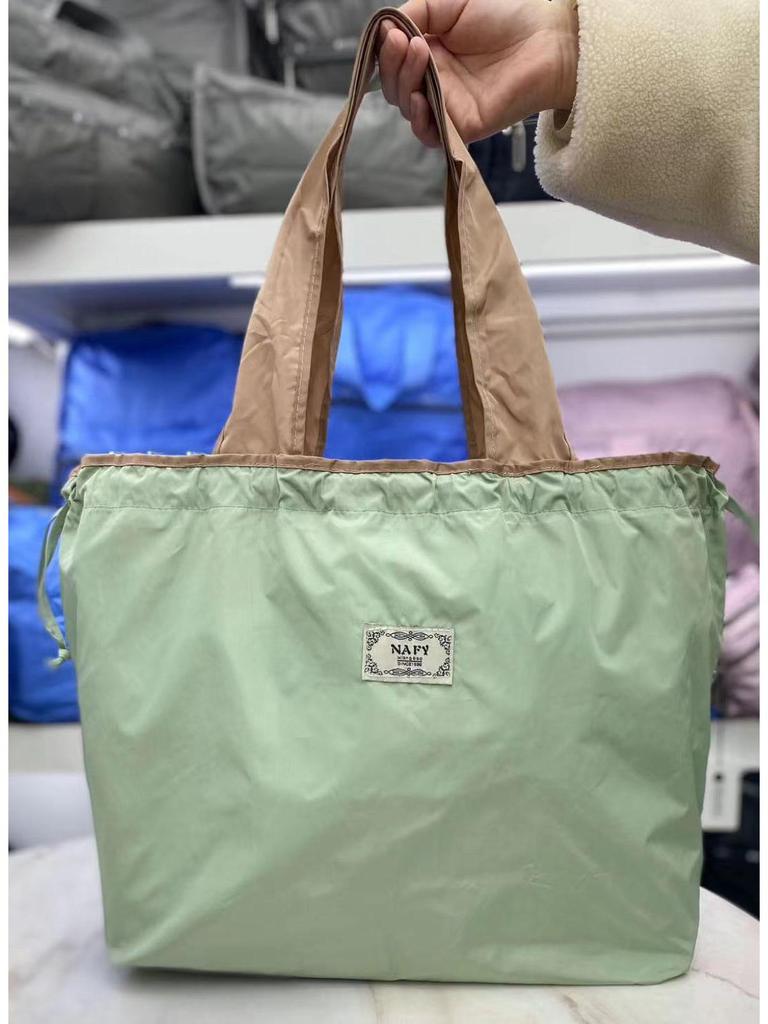Eco-friendly Lightweight Water-repellent Foldable Shopping Bag with Drawstring Closure and Large Capacity