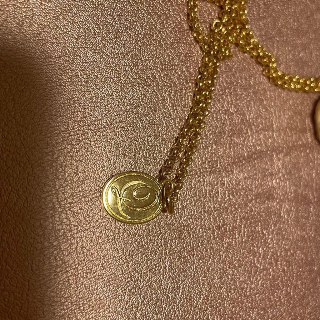 Used Q-POt banana chocolate necklace
