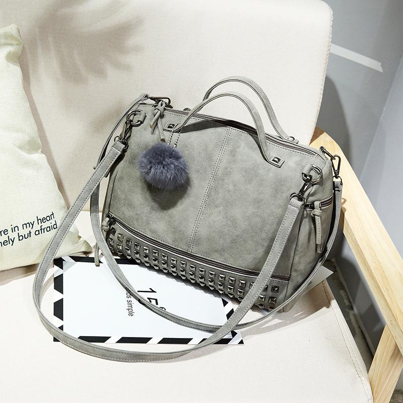 

Просування нових сумок весна та літо Європейські та американські модні жіночі сумочки на плечі з заклепками