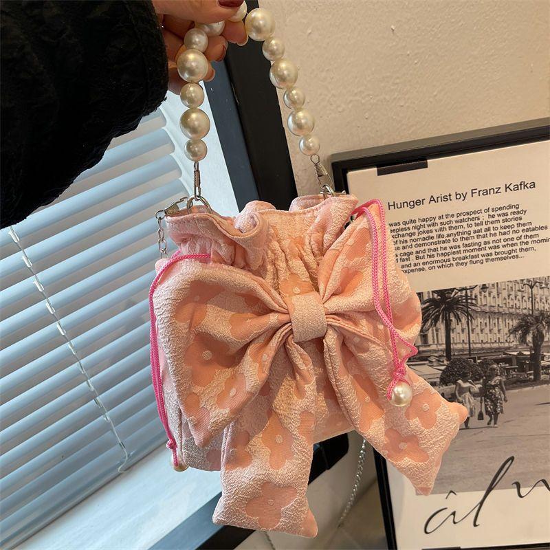 

Women s bags are popular this year, niche bags 2025 new trendy autumn versatile cute bow pearl portable messenger bags розовый