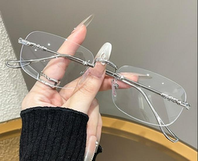 High-End Women's Rimless Blue Light Blocking Glasses - Fashionable Square Frame with Decorative Cut-Edge Design.