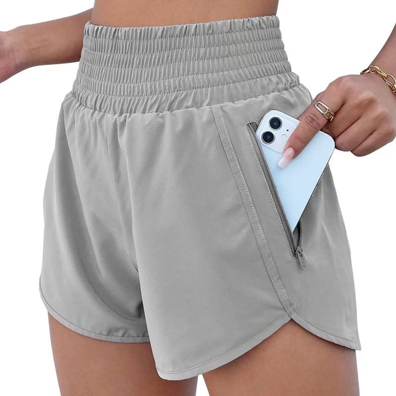 Pantalones cortos deportivos negros de cintura alta elástica con bolsillos con cremallera para mujer