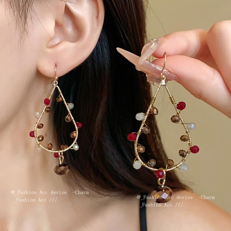 High-End Ethnic Teardrop Tassel Earrings with Cutout Design – Luxury Trend Jewelry
