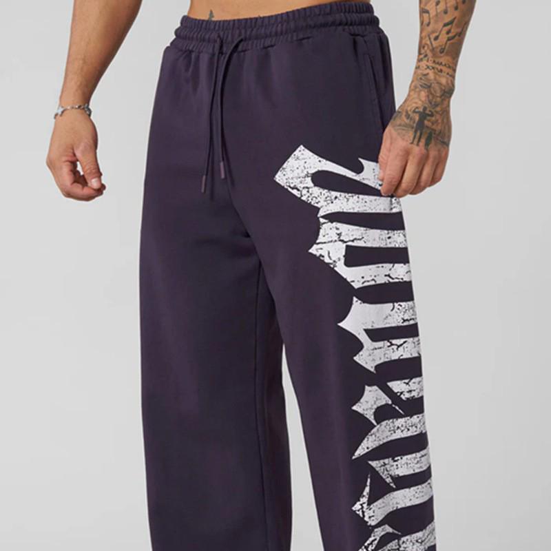 Pánské tepláky se širokými nohavicemi a velkým potiskem - Ležérní módní joggery