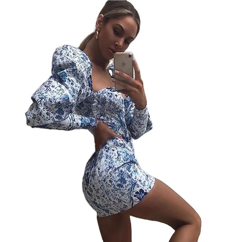 A Stylish Printed Puffed Sleeve Dress That Wraps Around The Chest and Hips Creating A Figure-hugging and Elegant Look