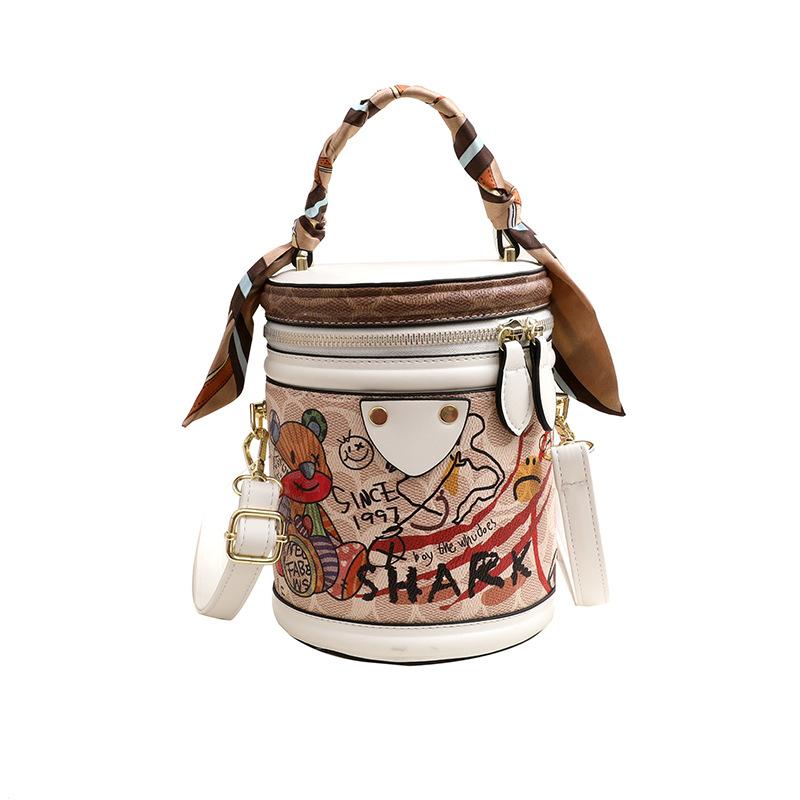 

Pu bag women s bag new Korean version 2025 fashion printing cartoon bear cute girl foreign style portable cylinder bag белый