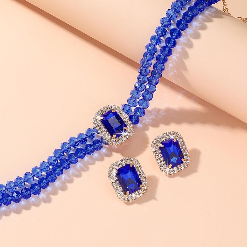 Luxuriöse doppellagige geometrische Kristallkette und rechteckiges Ohrstecker-Set