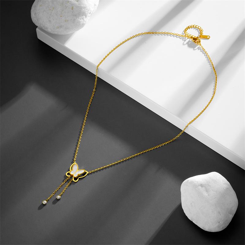 Stylish Titanium Steel Women's Necklace: Double-Layer White Shell with Rhinestone Butterfly Tassel, Hollow Design Collarbone Chain.