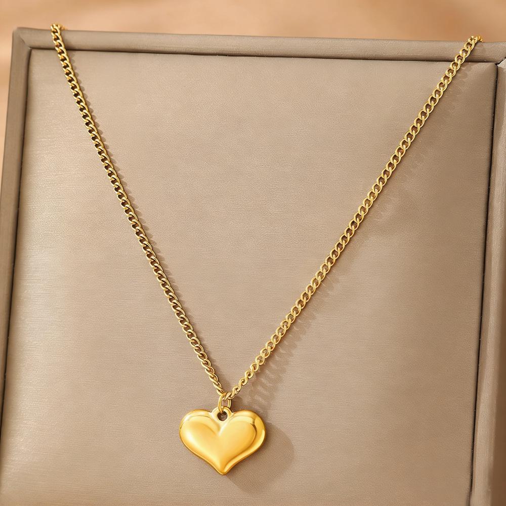 Gold Stainless Steel Cross Necklace - Light Luxury High-End Collarbone Chain with Gold Heart.