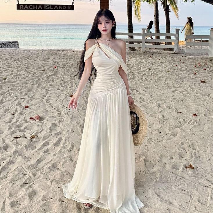 French white off-the-shoulder hollow pleated dress, high-end female summer pure desire wind vacation beach fairy long dress