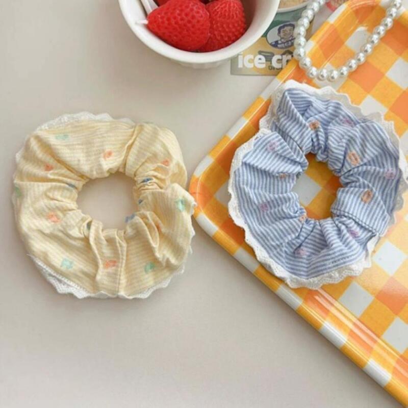 A feminine pastel-colored tripe set of two 2-piece set