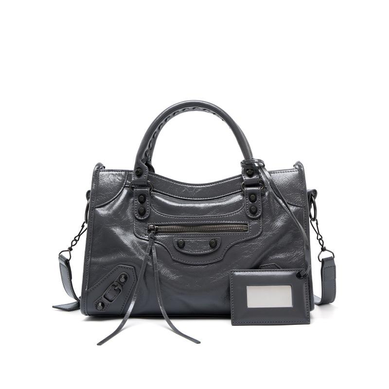 Spice girl rivet locomotive bag retro messenger leather large capacity tote bag niche leather handbag women