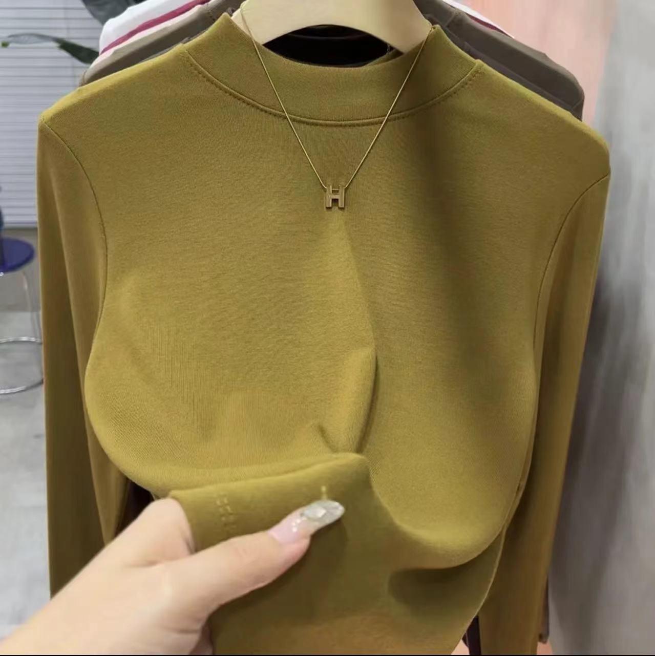 

Женская приталенная футболка с высоким воротником однотонная со средним вырезом - Мода весна-осень 2025 Large