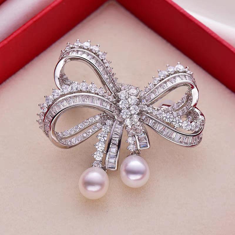 European and American light luxury bow bead pendant brooch new fashion accessories women's suit coat exquisite temperament pin