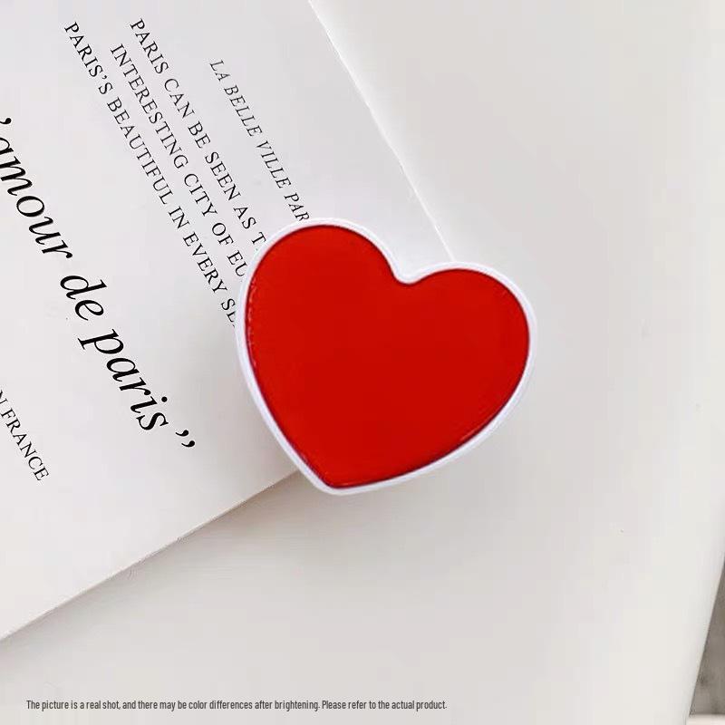 

Airbag Heart-Shaped Retractable Phone Holder - Creative Solid Color Gift with Logo