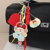 Süßer PU-Apfel-Welpen-Anhänger Cartoon-Anhänger Kleine Tasche Liebe Geflochtenes Seil Taschenanhänger Schlüsselanhänger