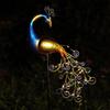 Solar Peacock Light: Waterproof Wrought Iron Garden Ornament for Lawn and Courtyard.